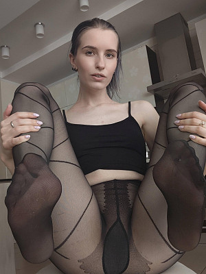 Private photos of girls wearing black patterned pantyhose without panties